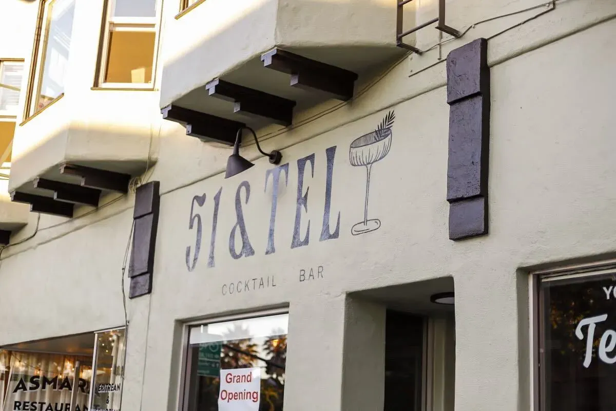 Bar exterior with sign.